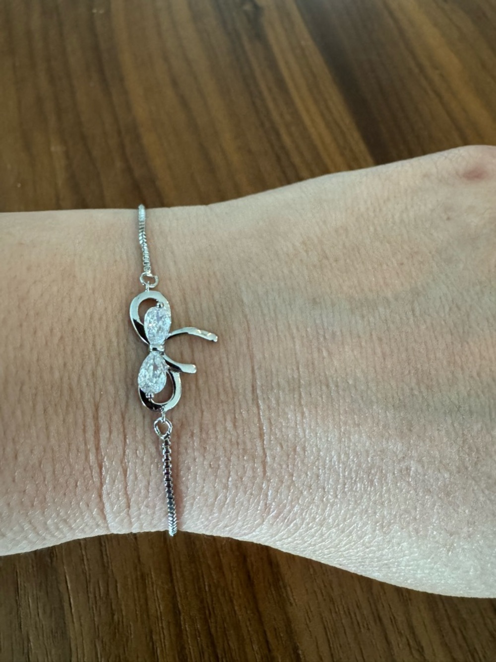 Delicate Silver Bow Bracelet with Crystal Accents - Women's Jewelry